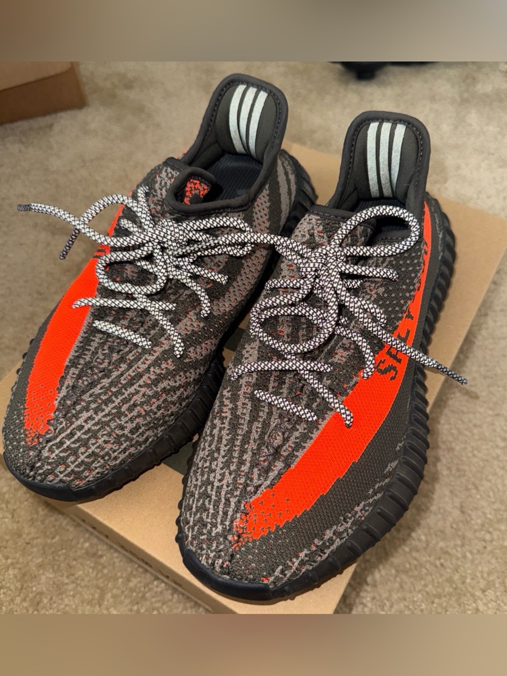 adidas women’s Yeezy Boost 350 V2 Black & Orange Stripe Sneakers